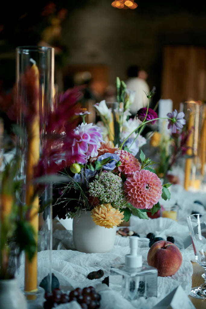 NYC Brooklyn the green building September flowers seasonal dahlias sedum cosmos lisianthus reception table flowers Molly Oliver Flowers ceramic vase golden beeswax taper candles peach fruitscaping