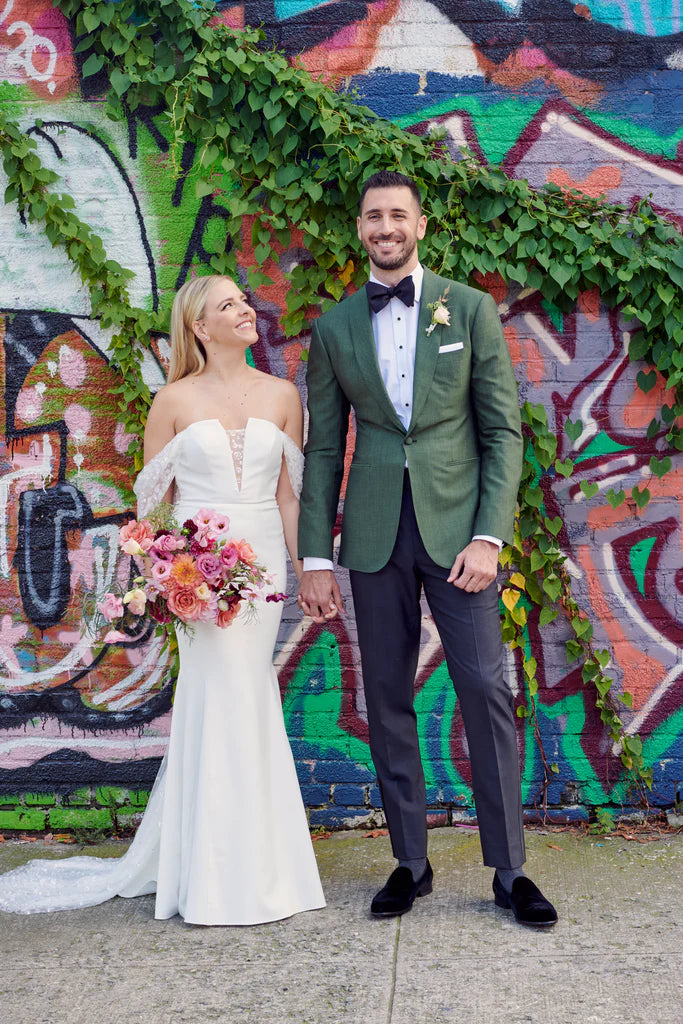 Brooklyn NY couple portrait graffiti seasonal flowers sustainable floristry pink and peach bridal bouquet garden roses cosmos lisianthus dahlias boutonniere