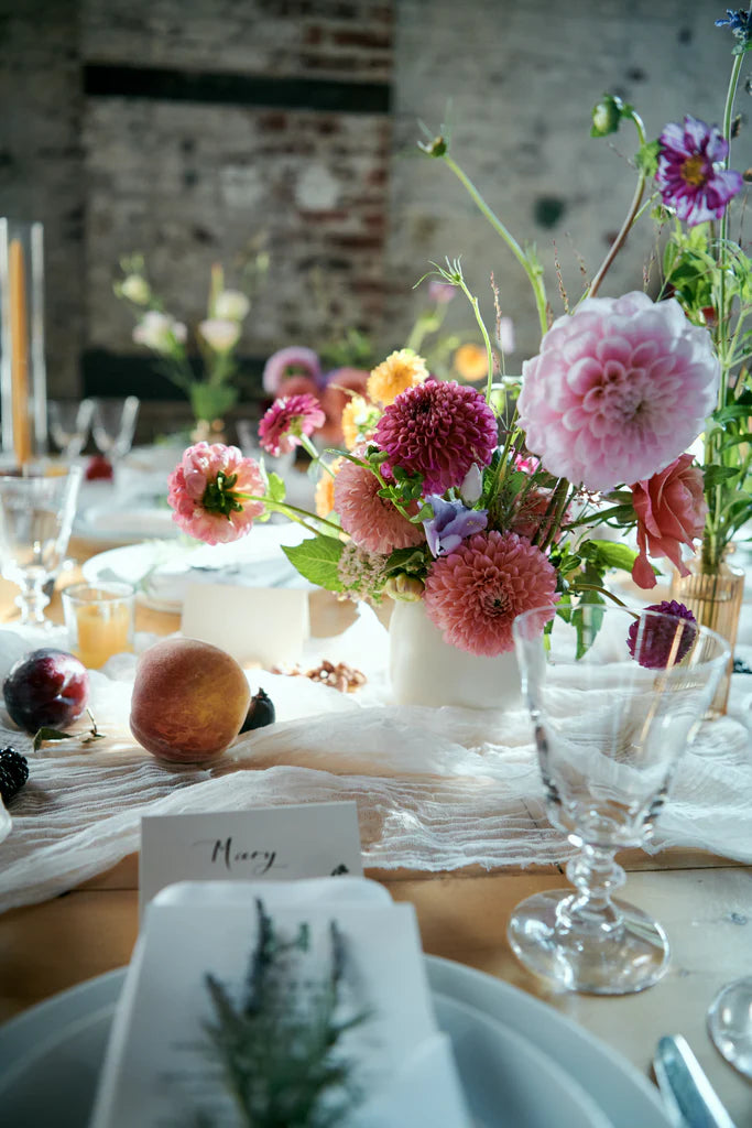 Brooklyn NYC the green building wedding reception flowers kings table small arrangements bud vases fruitscaping ball dahlias peaches and cream cheesecloth runner Molly Oliver Flowers