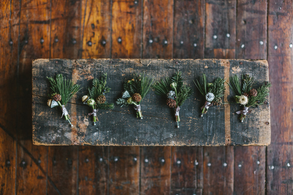 Winter wedding green point loft Brooklyn NYC pinecone boutonniere sustainable florist pine rustic Molly Oliver Flowers Events