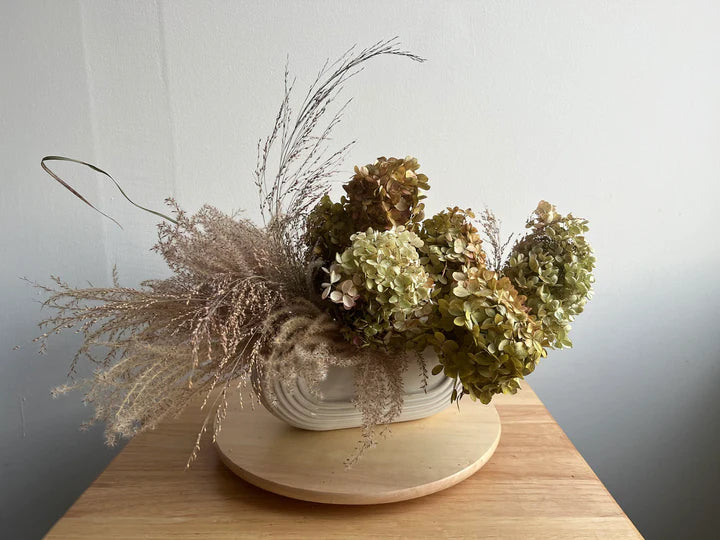 Molly Oliver Flowers NYC dried winter everlasting arrangement trough style thanksgiving miscanthus and hydrangea modern dried flowers