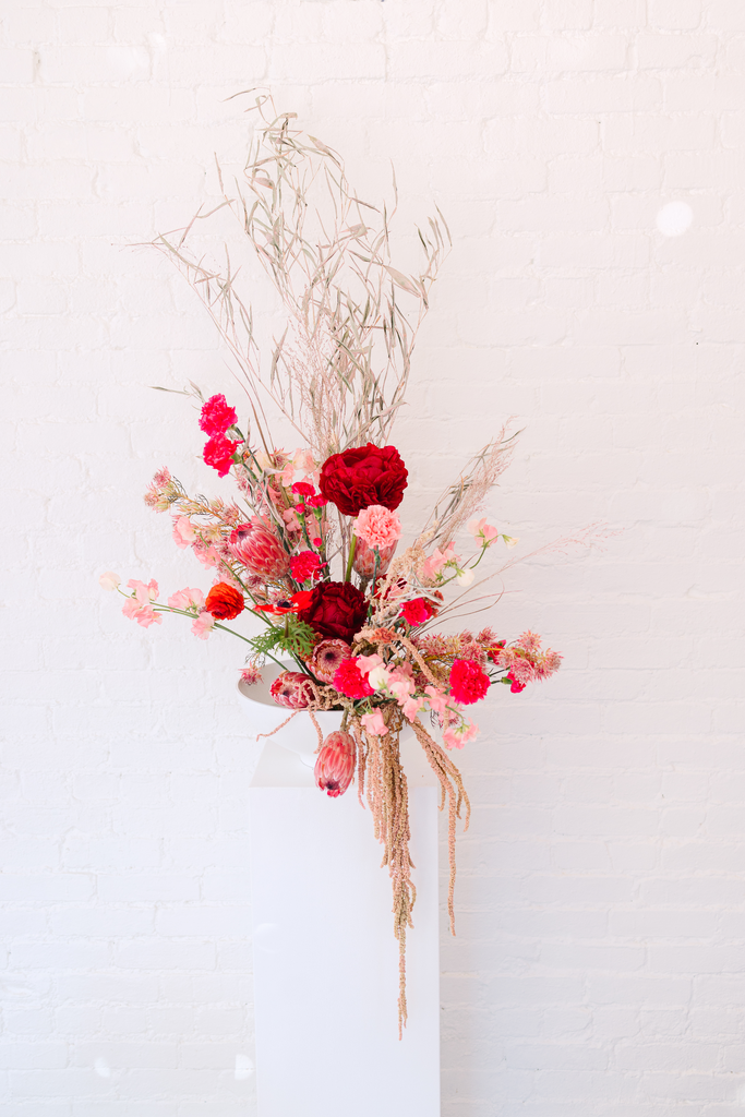 Brooklyn NY February elopement Brindamour Studios Red and Pink Molly Oliver Flowers winter wedding valentines day sustainable eco friendly lgbtq wedding ceremony modern florals ikebana inspired ceremony urn arrangement carnations anemones tulips dyed amaranth sweet pea protea NYC