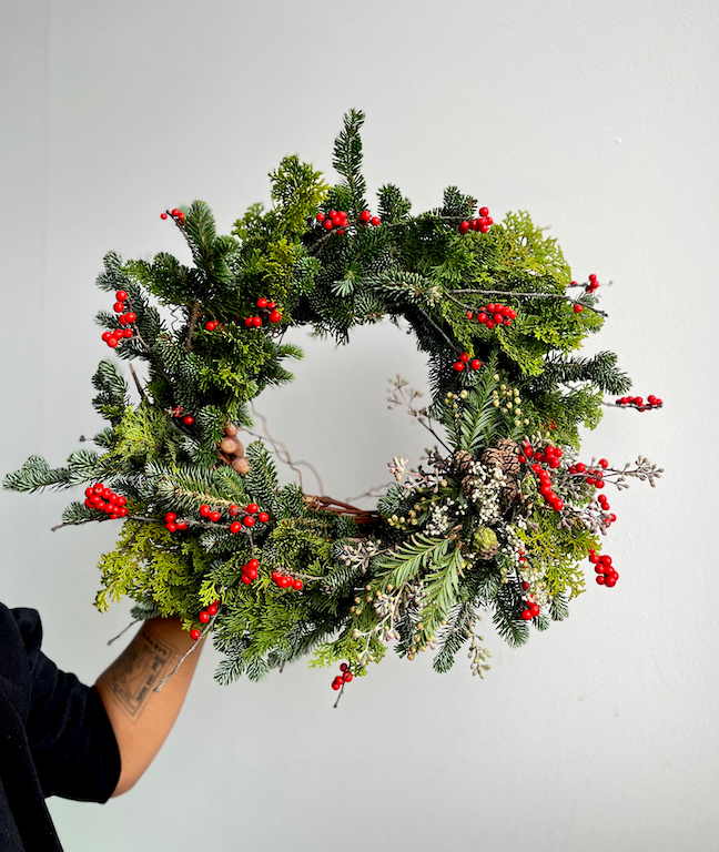 Holiday Red Wreath, featuring Maine Balsam, Hinoki Cypress, Redwood tips and baby cones, painted pinecones and Red Ilex berries