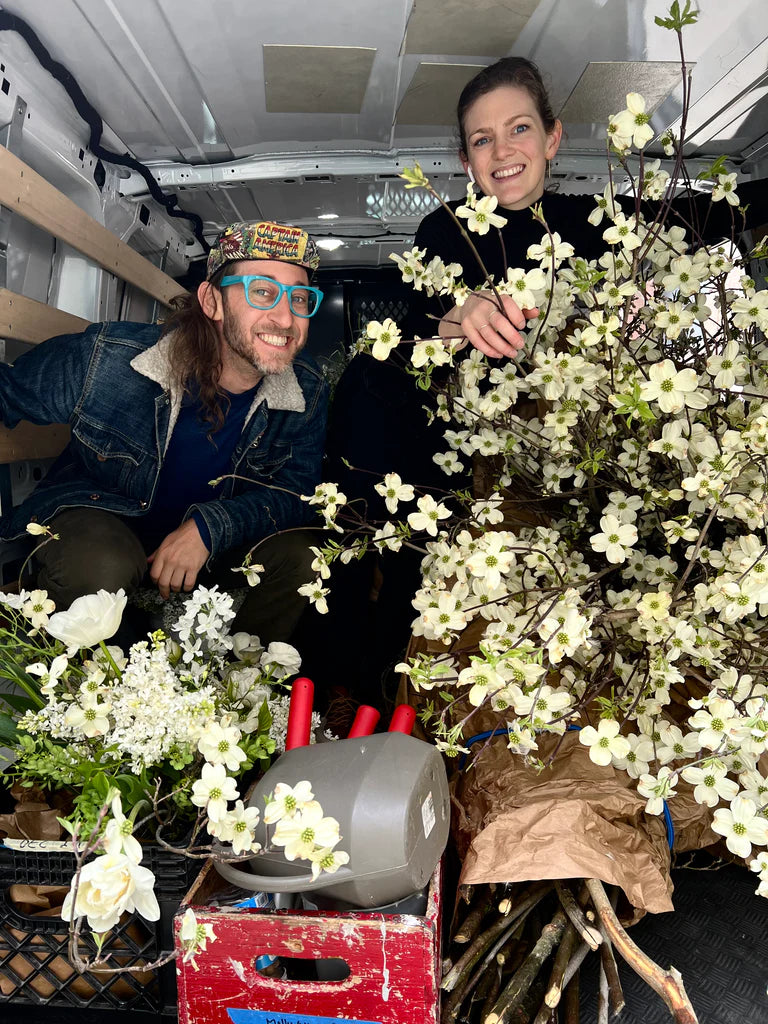 Josh & Paige delivering bouquets by truck for Molly Oliver Flowers