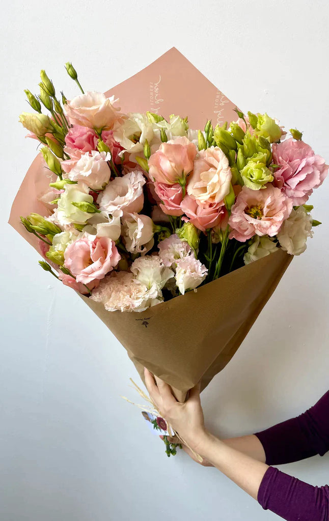 deluxe handtied seasonal flower arrangement summer peach and pink lisianthus kraft paper compostable tissue flower delivery nyc brooklyn