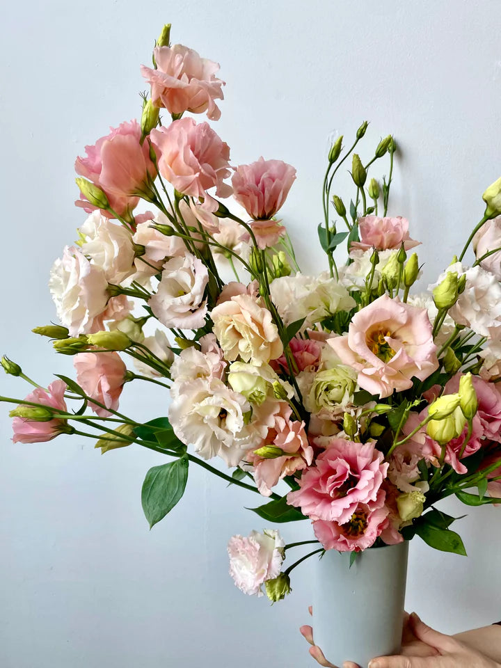 modern deluxe seasonal flower arrangement in ceramic vase summer peach and pink lisianthus flower delivery nyc brooklyn