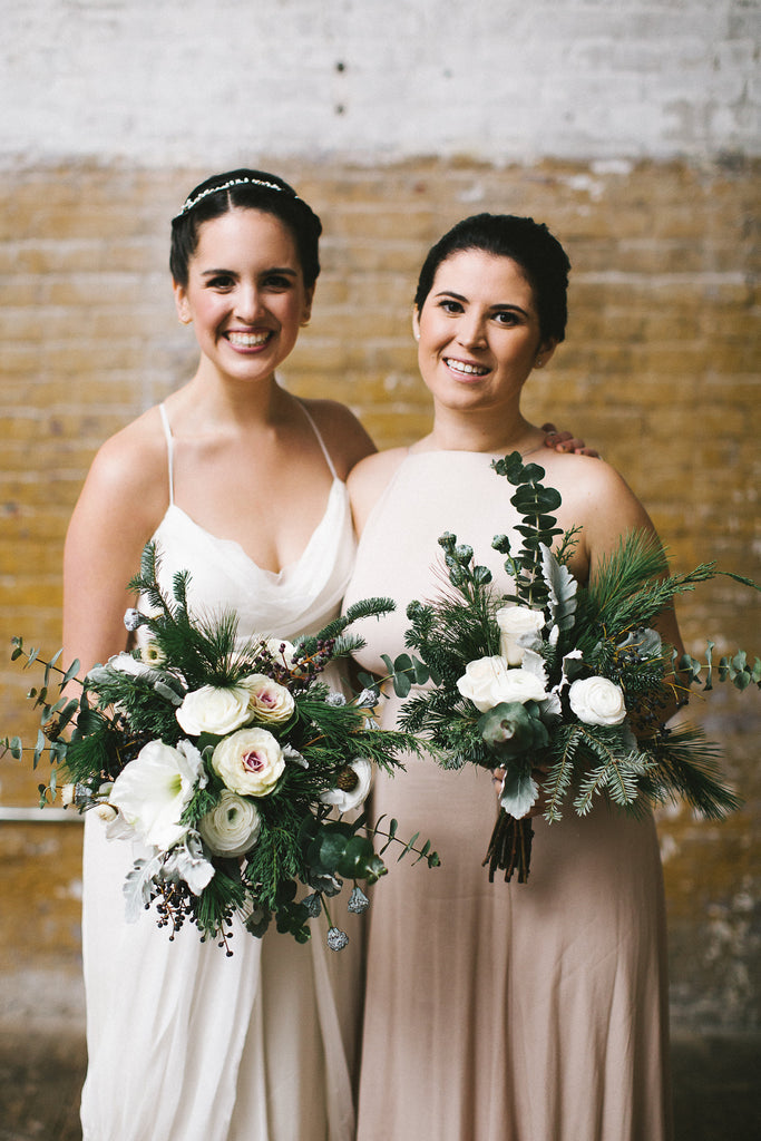 Winter wedding Brooklyn NY Greenpoint Loft evergreen brown silver Molly Oliver Flowers eco friendly sustainable December flowers pine warm wintry eco friendly florist bridesmaid bouquet Champagne dresses eucalyptus ornamental kale ranunculus amaryllis