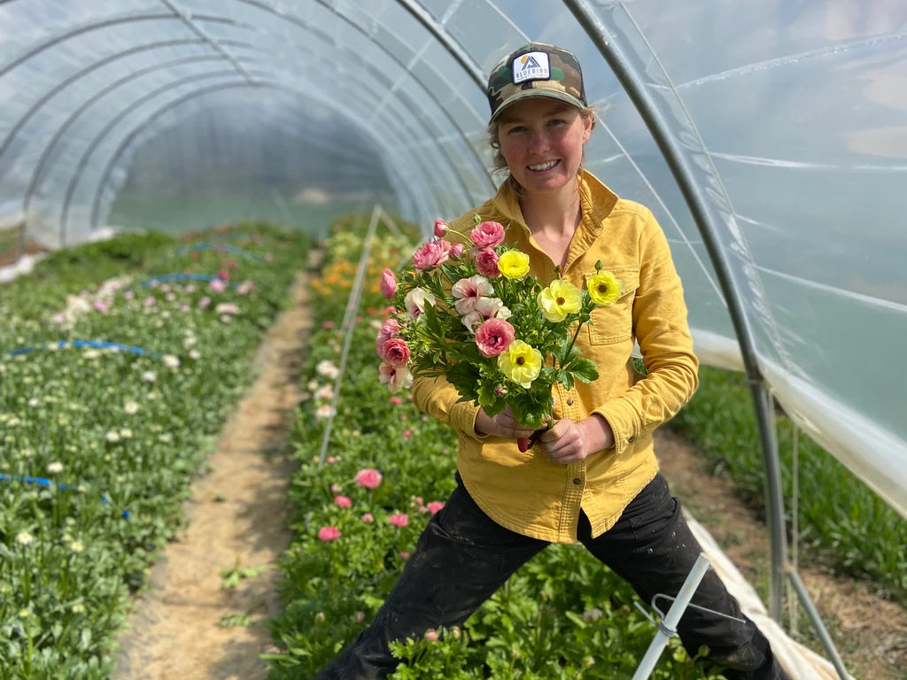 Julia Bull Hickory Grove Gardens Phoenixville, PA Holding Butterfly Ranunculus local flowers for Molly Oliver Flowers