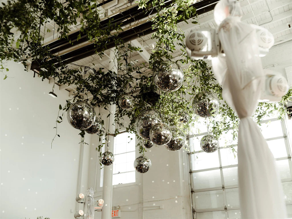 NYC Jewish wedding disco ball dance floor with hanging greenery sound river studios summer wedding Long Island city
