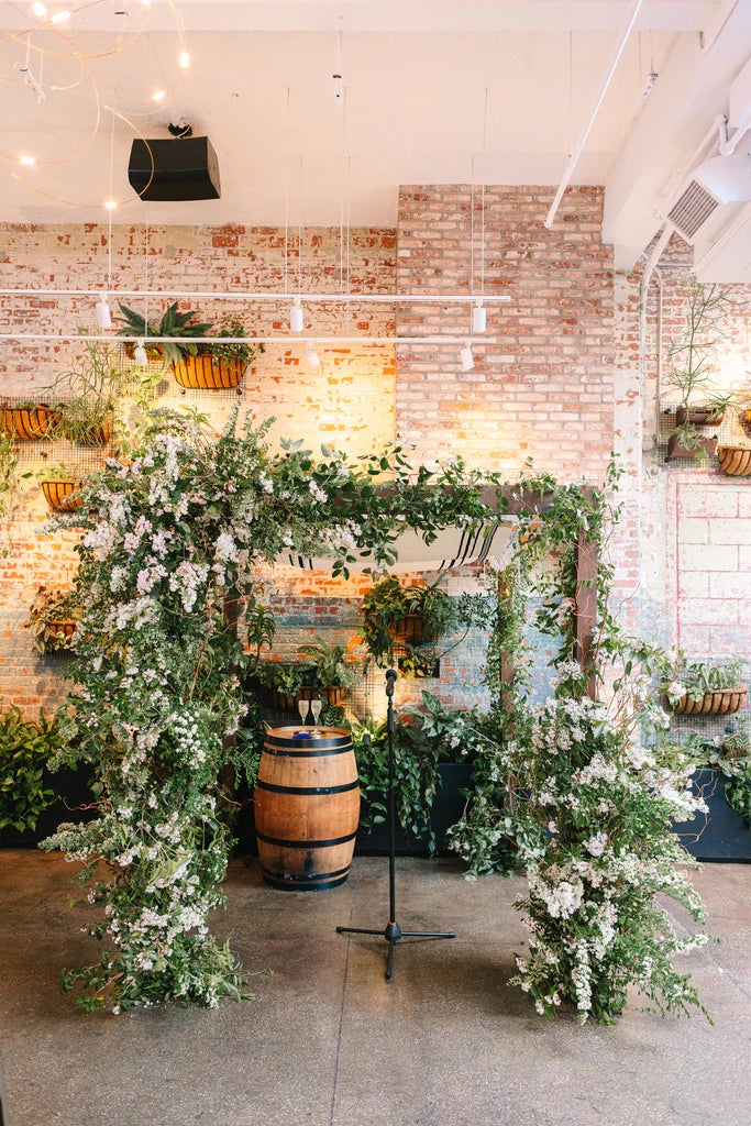 floral decorating wedding canopy at alexis & eric NYC wedding flowers by molly oliver