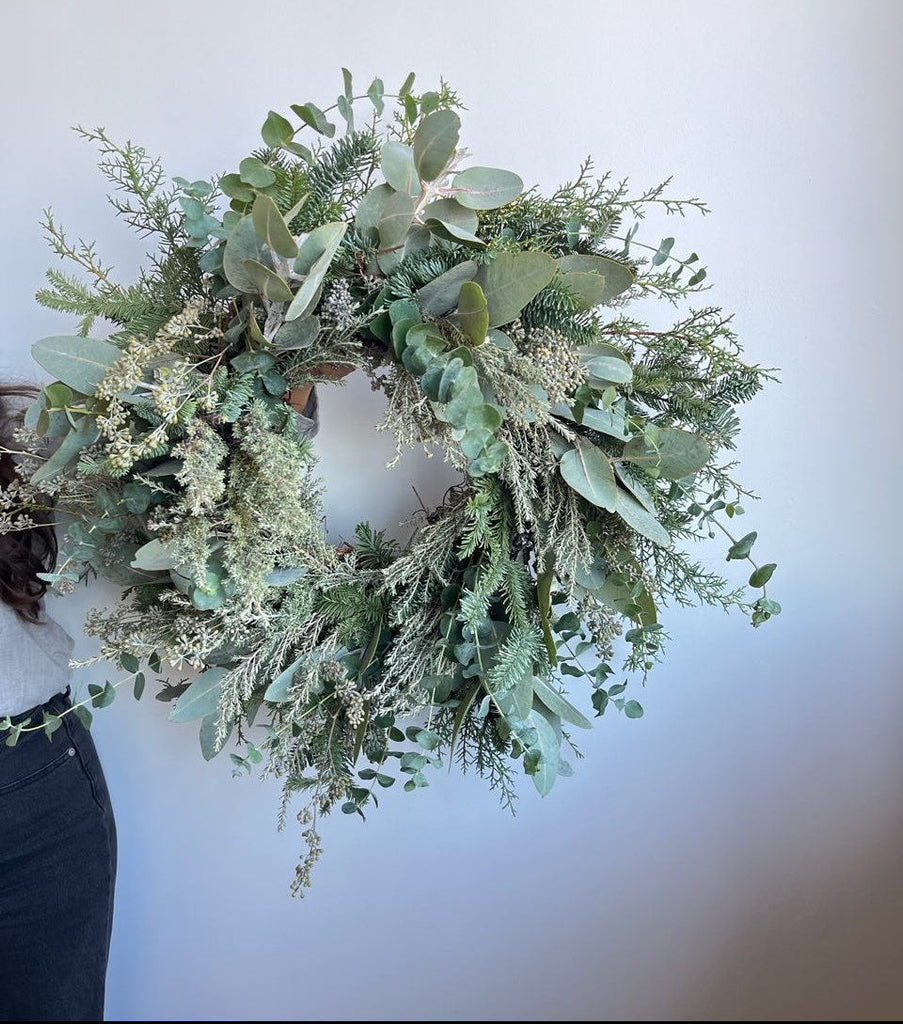 snowy blue evergreen wreath holiday